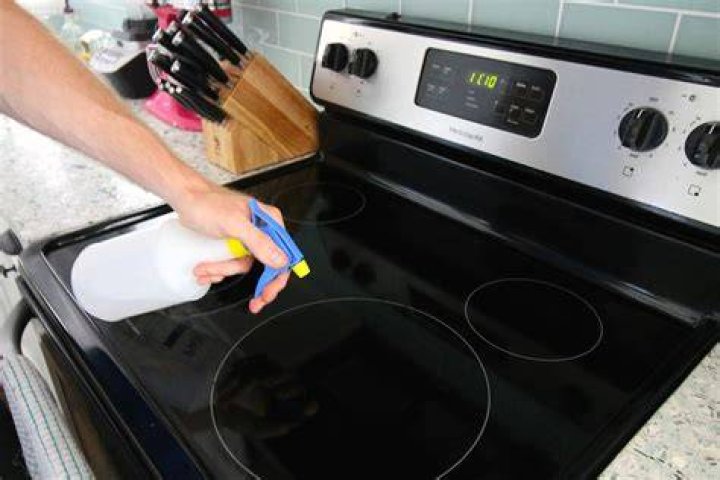 What is the best way to clean a stove top?