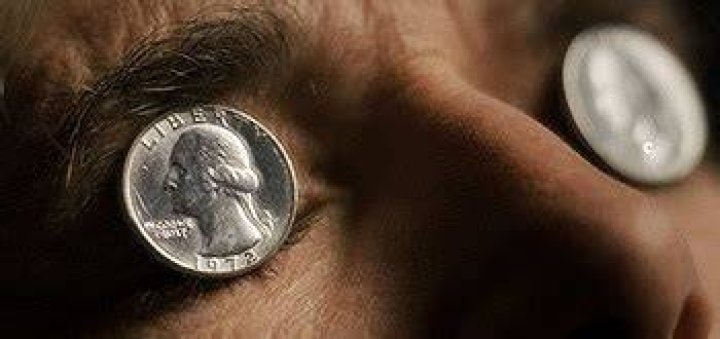 Why did they put coins over eyes?