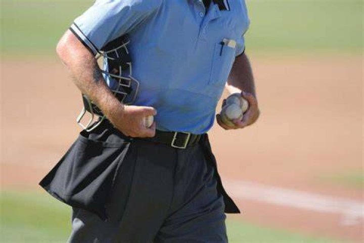 Why do umpires wear blue?